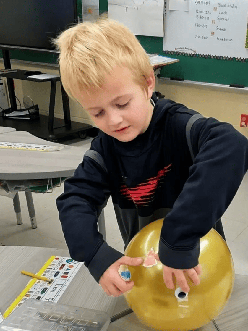 Student exploring a hands-on STEM activity