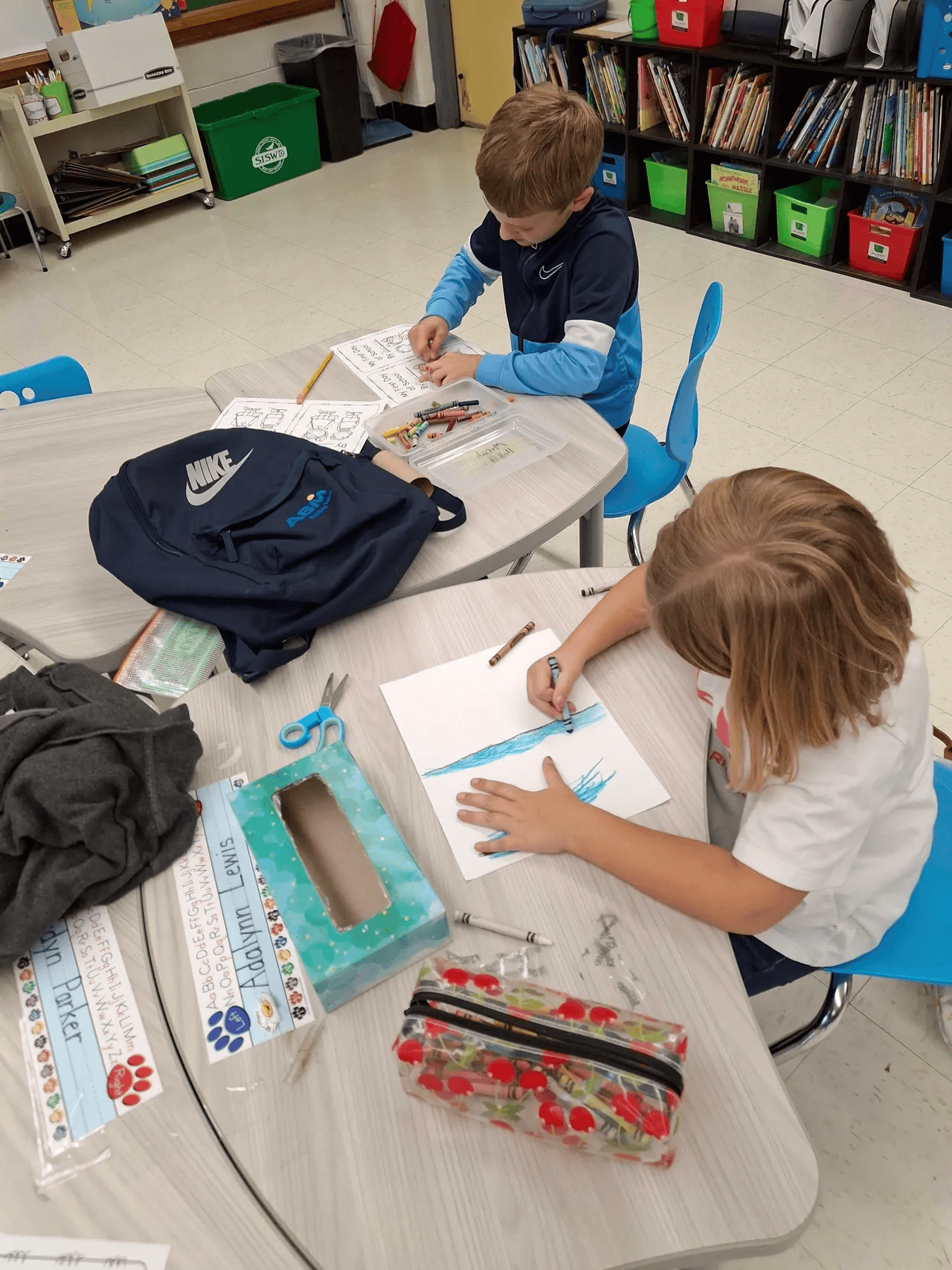 Two students working together at a classroom table